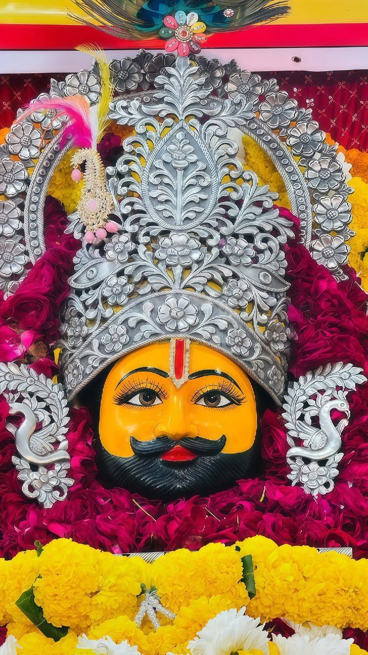 Close-up of Ramdevpir\'s face with flowers