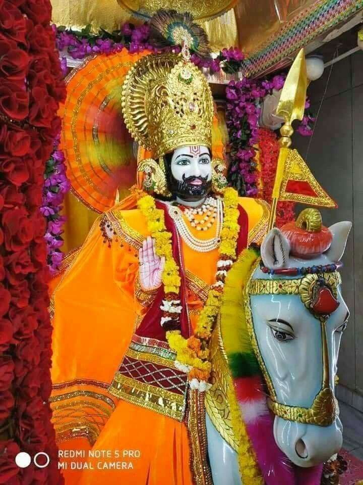 Ramdevpir riding a white horse