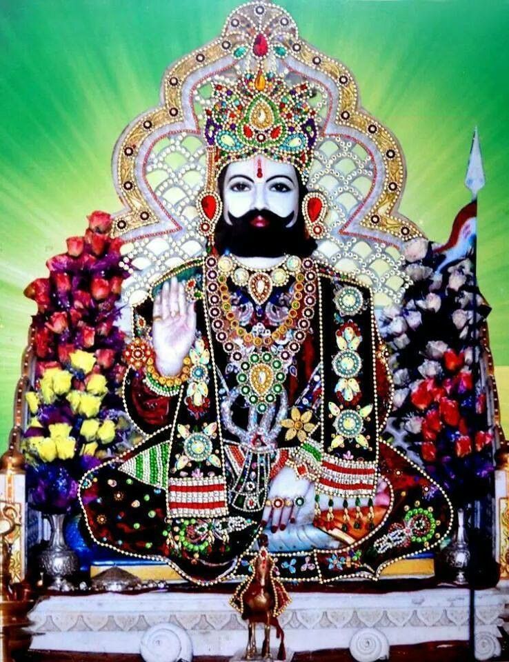 Ramdevpir adorned with flowers and crown