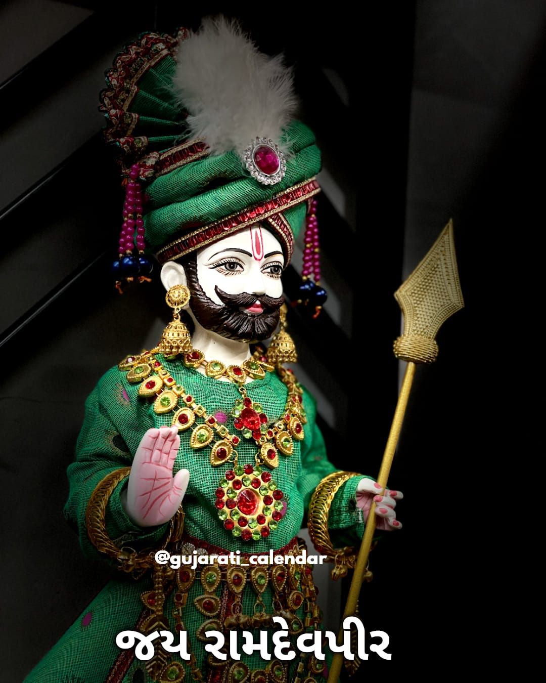 Ramdevpir with ornate jewelry and turban