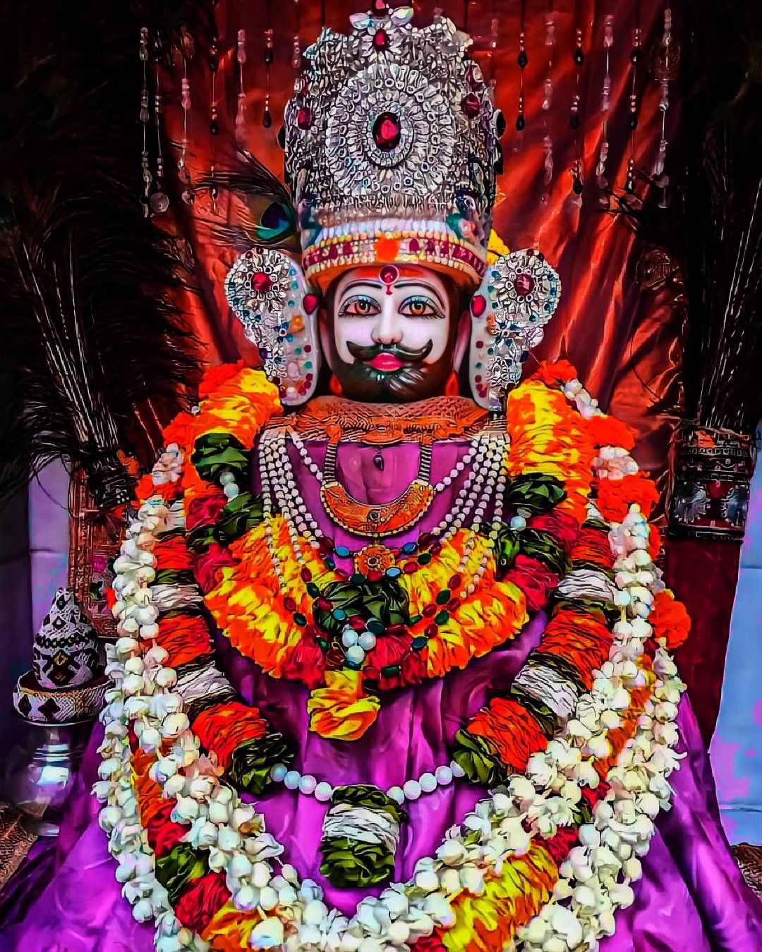 Ramdevpir with floral garland and headgear