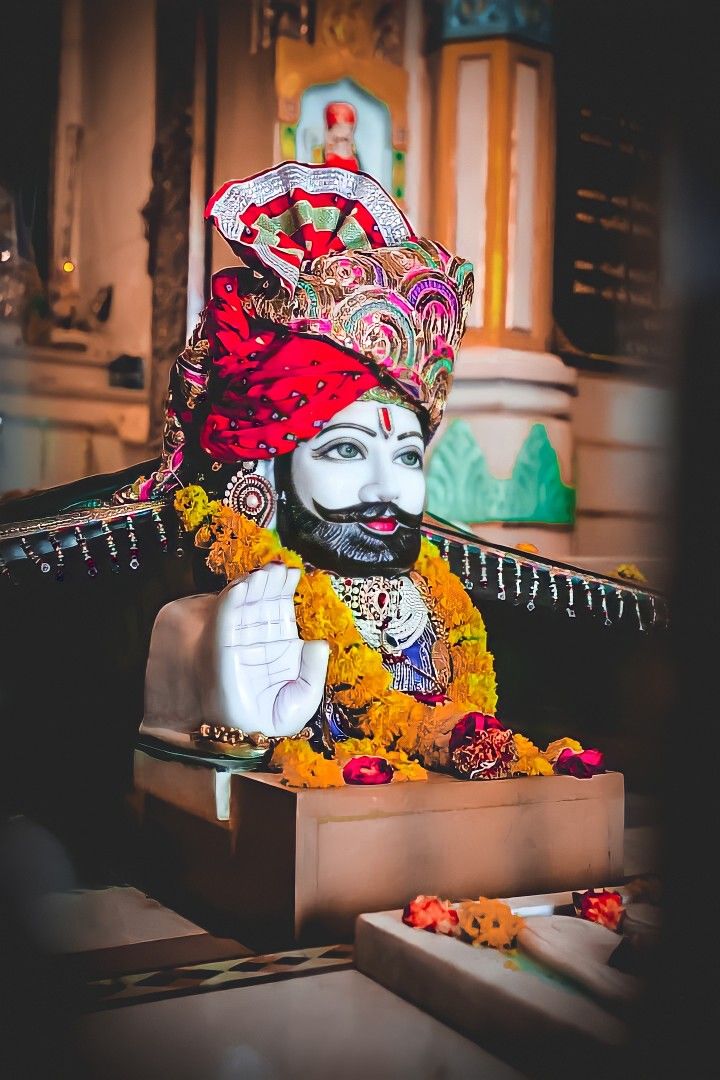 Baba Ramdevpir statue adorned with flowers