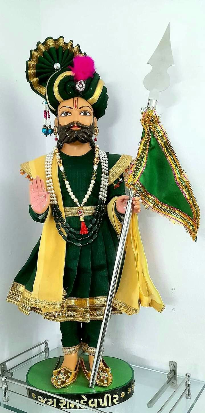 Ramdevpir with ornate turban and flag