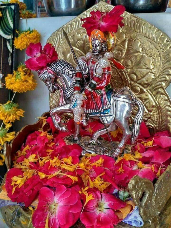 Ramdevpir on horseback with floral offering