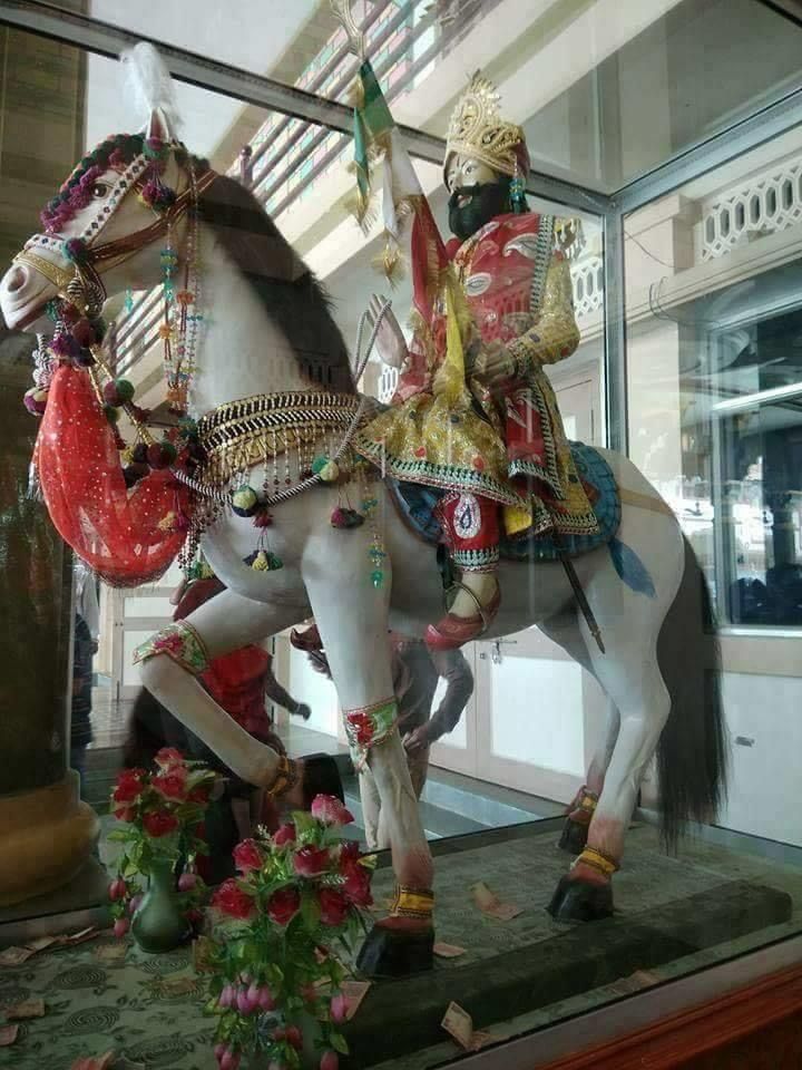 Ramdevpir mounted on a white horse