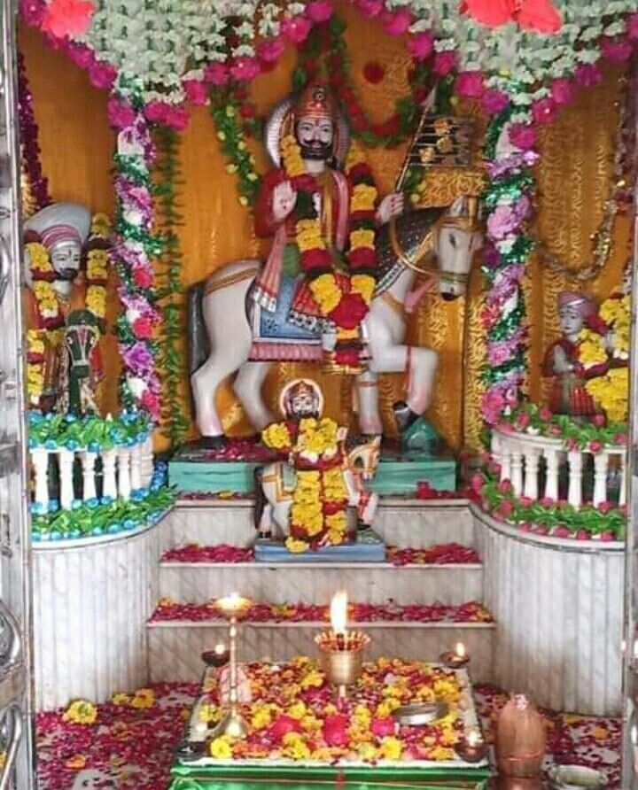 Ramdevpir on horseback in temple setting