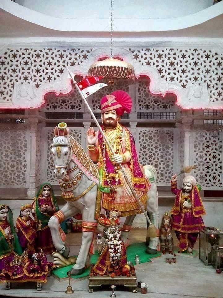 Ramdevpir riding a white horse