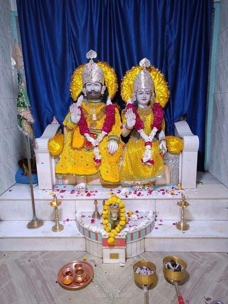 Ramdevpir statues in a temple setting