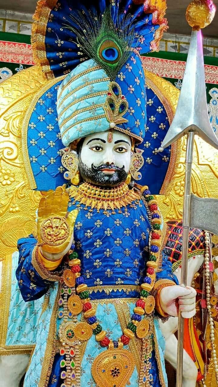 Ornate deity portrait with spear and crown