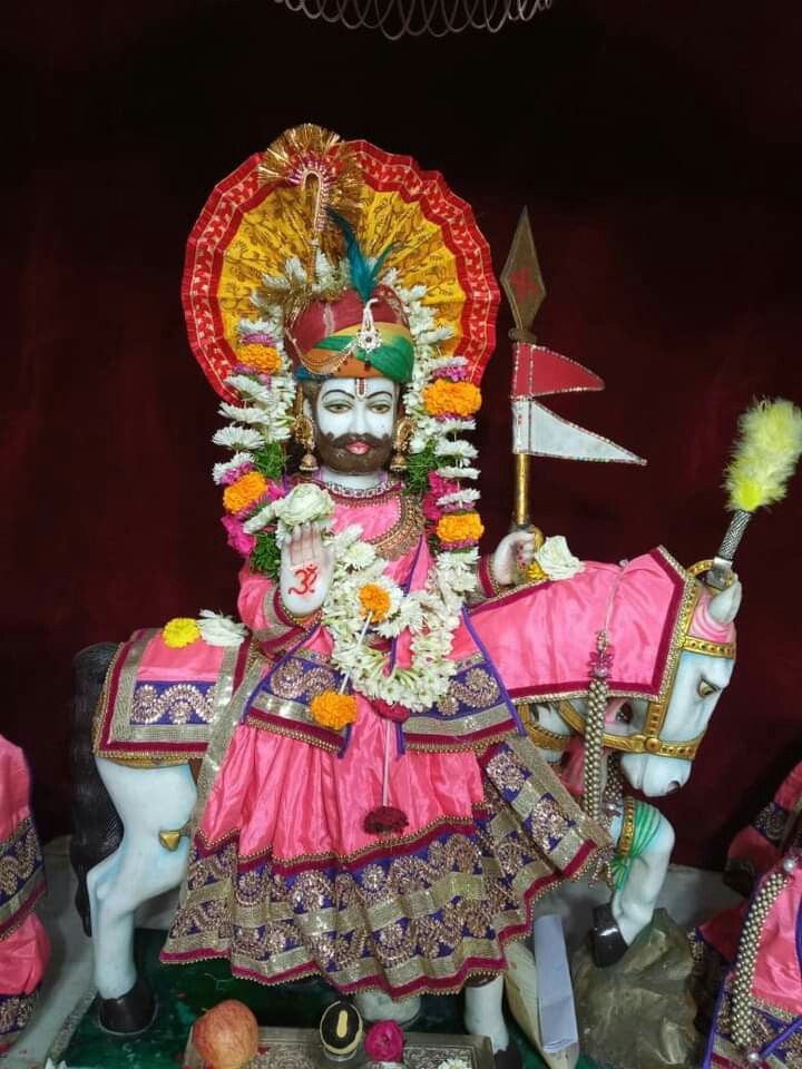 Ramdevpir riding a white horse