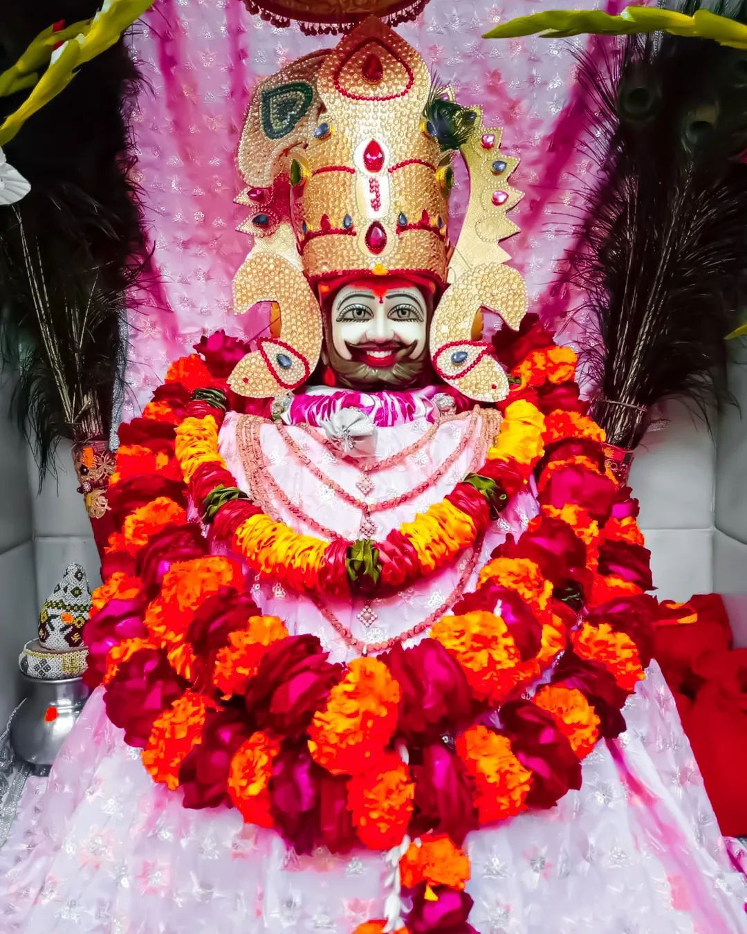 Smiling Ramdevpir with flower garland