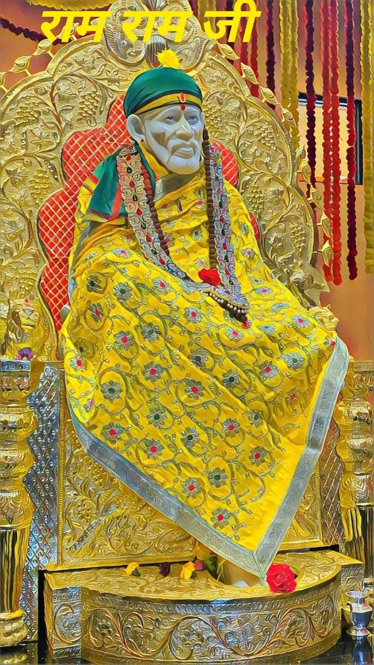 Sai Baba in golden floral attire