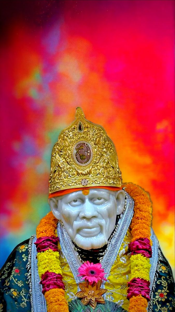 Sai Baba with golden crown and flowers