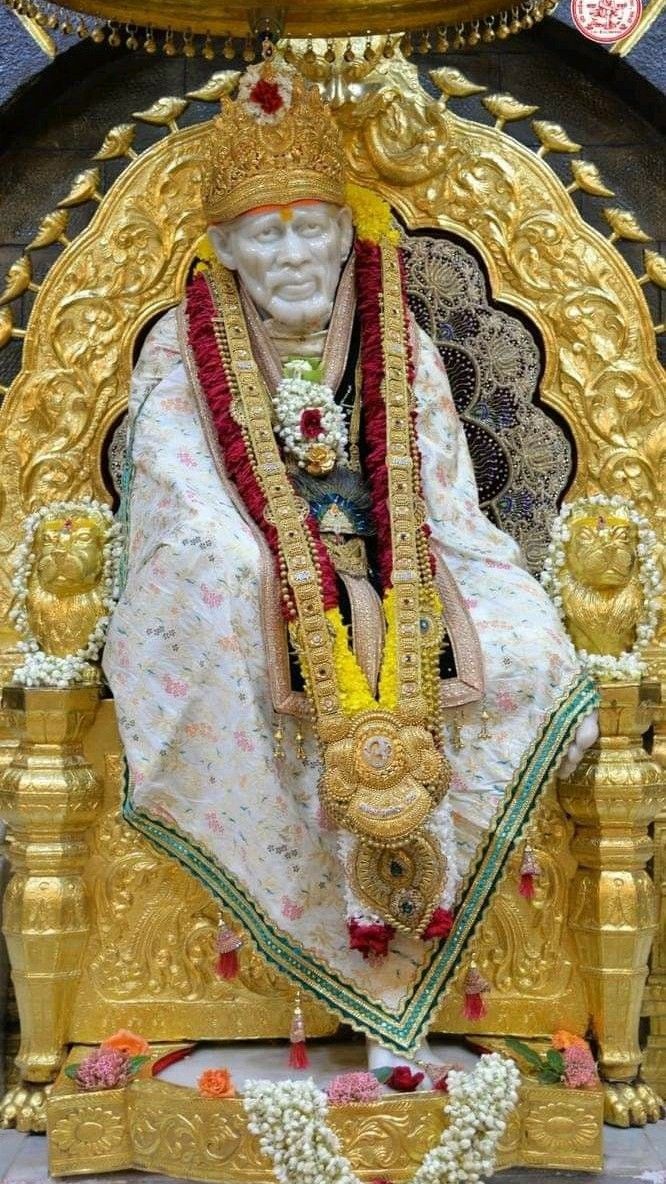 Sai Baba seated on golden throne