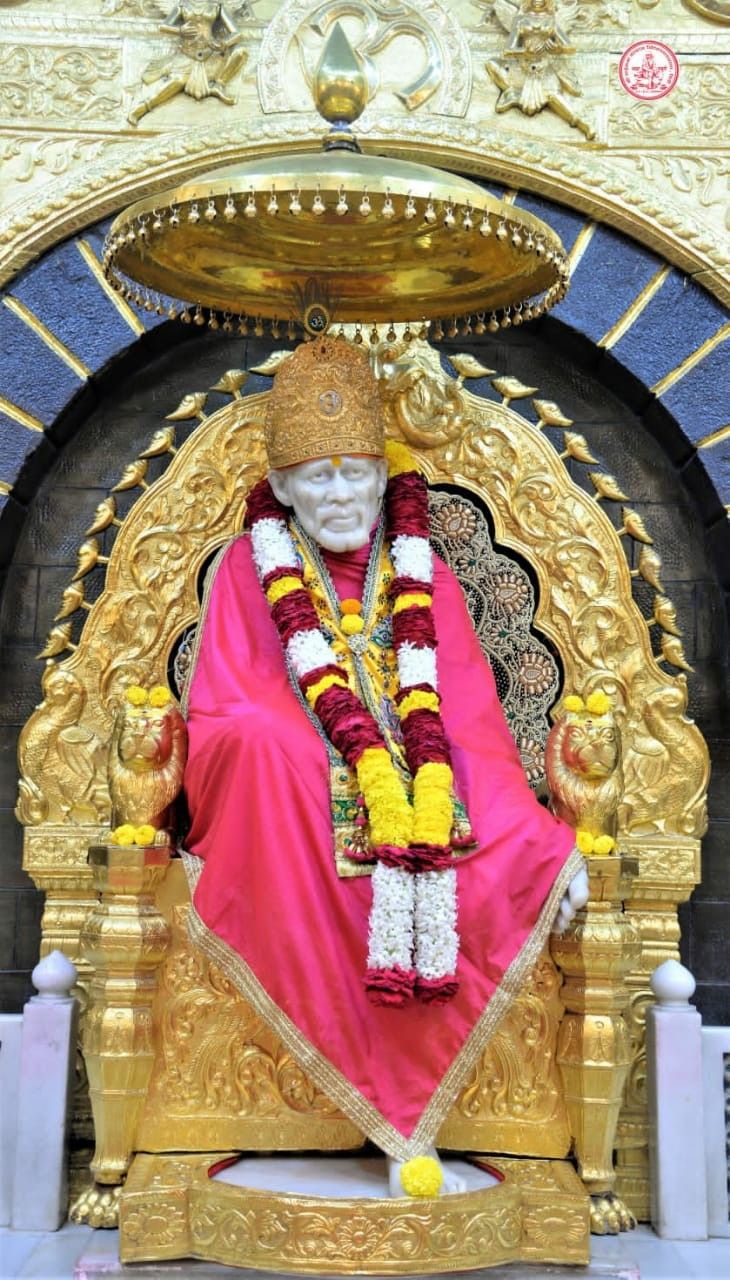 Sai Baba seated on golden throne