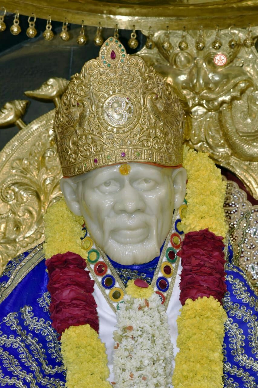 Sai Baba with golden crown.