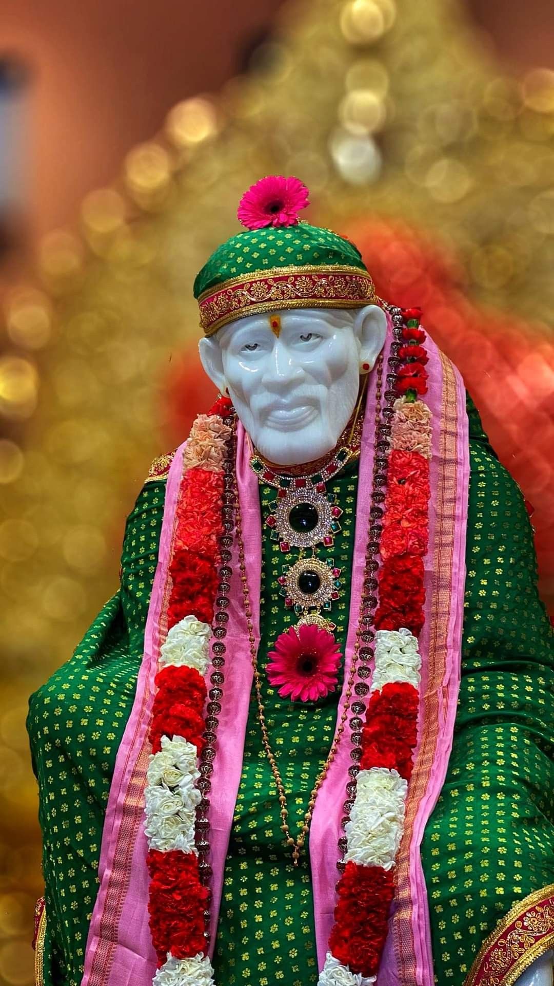 Sai Baba with floral garland, divine image