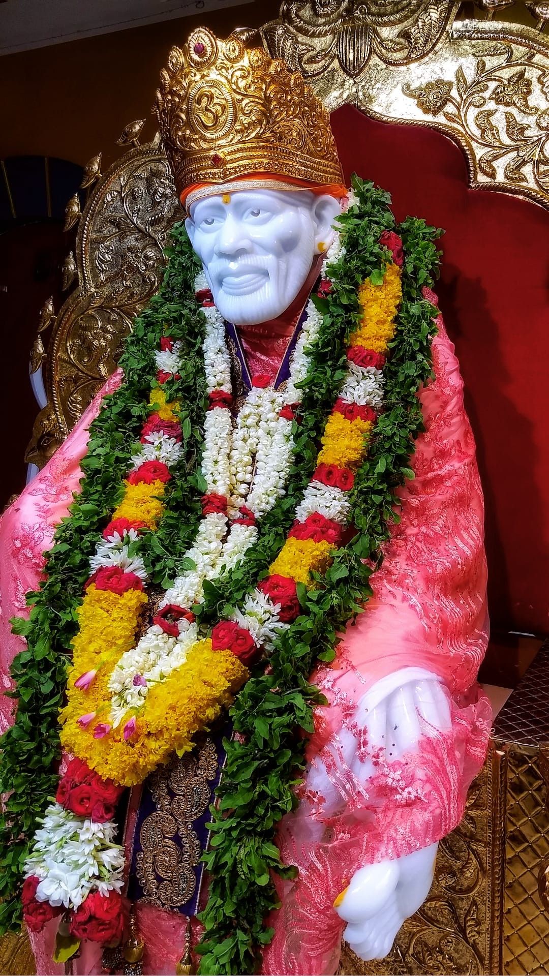 Sai Baba adorned with flowers