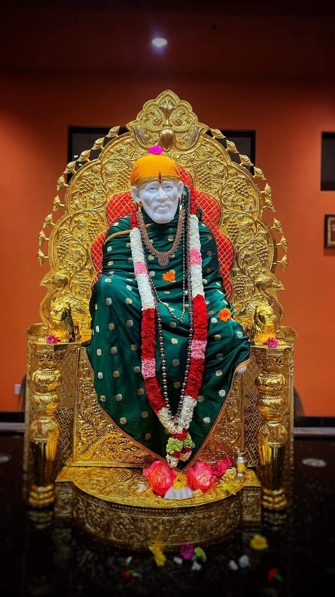 Sai Baba on golden throne idol
