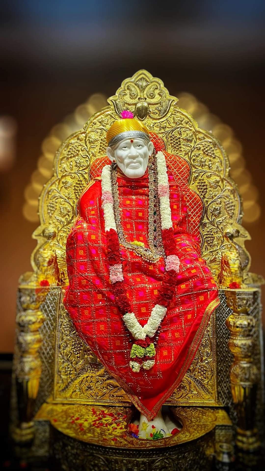 Sai Baba on golden throne