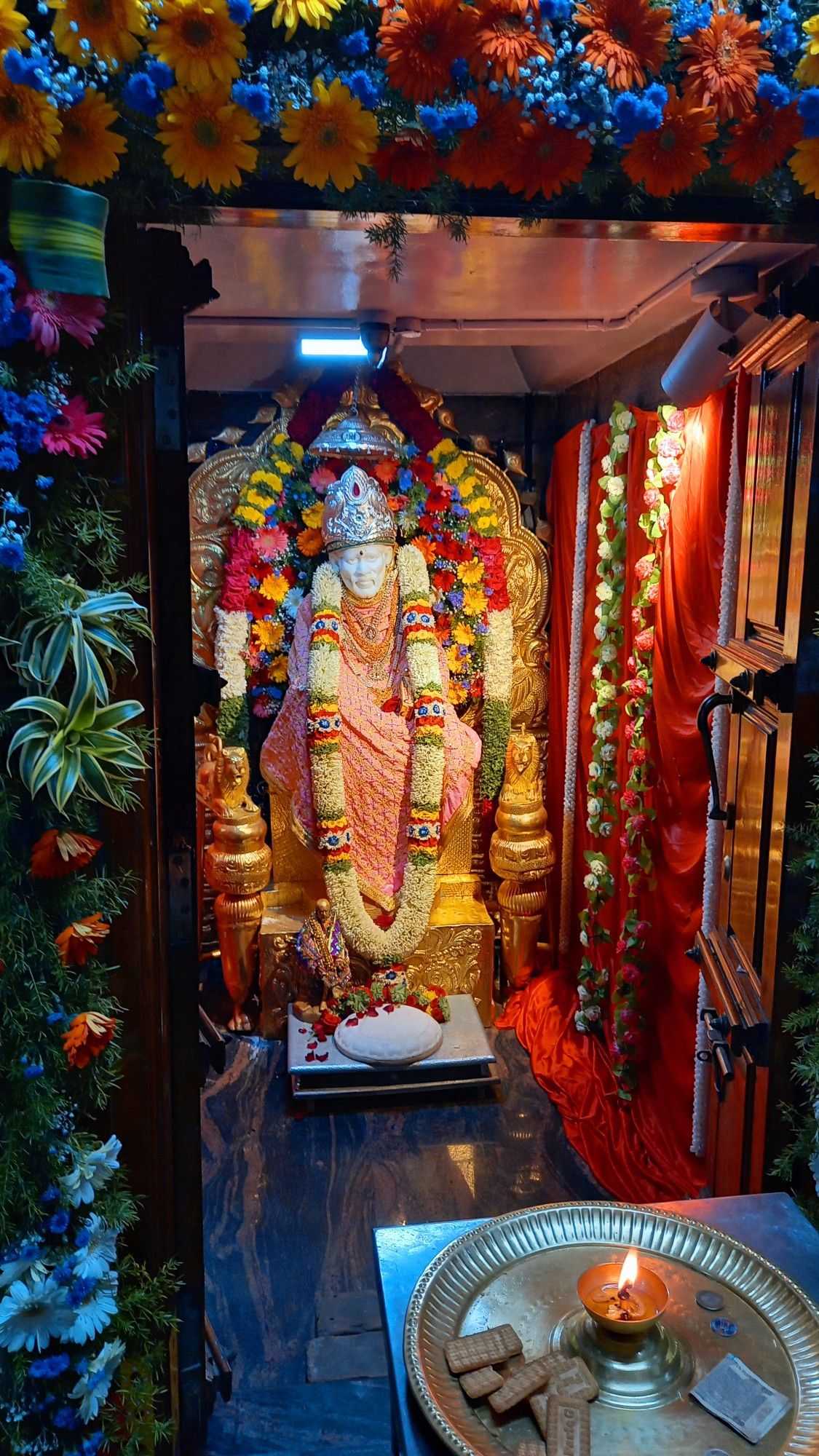 Sai Baba idol in temple setting