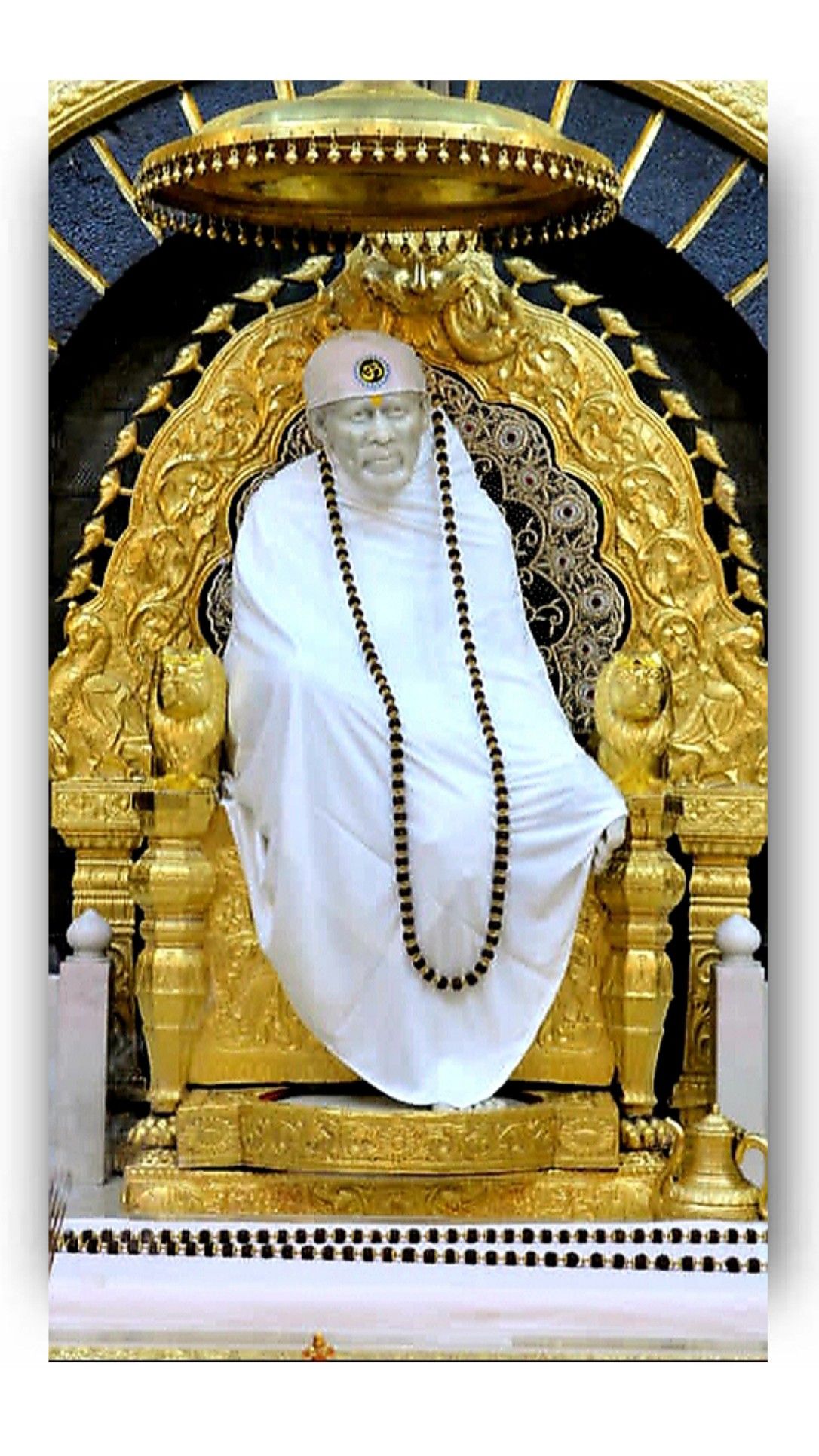 Sai Baba of Shirdi in golden frame
