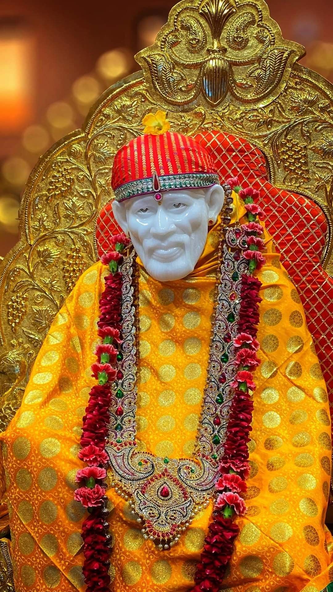 Sai Baba portrait on golden throne