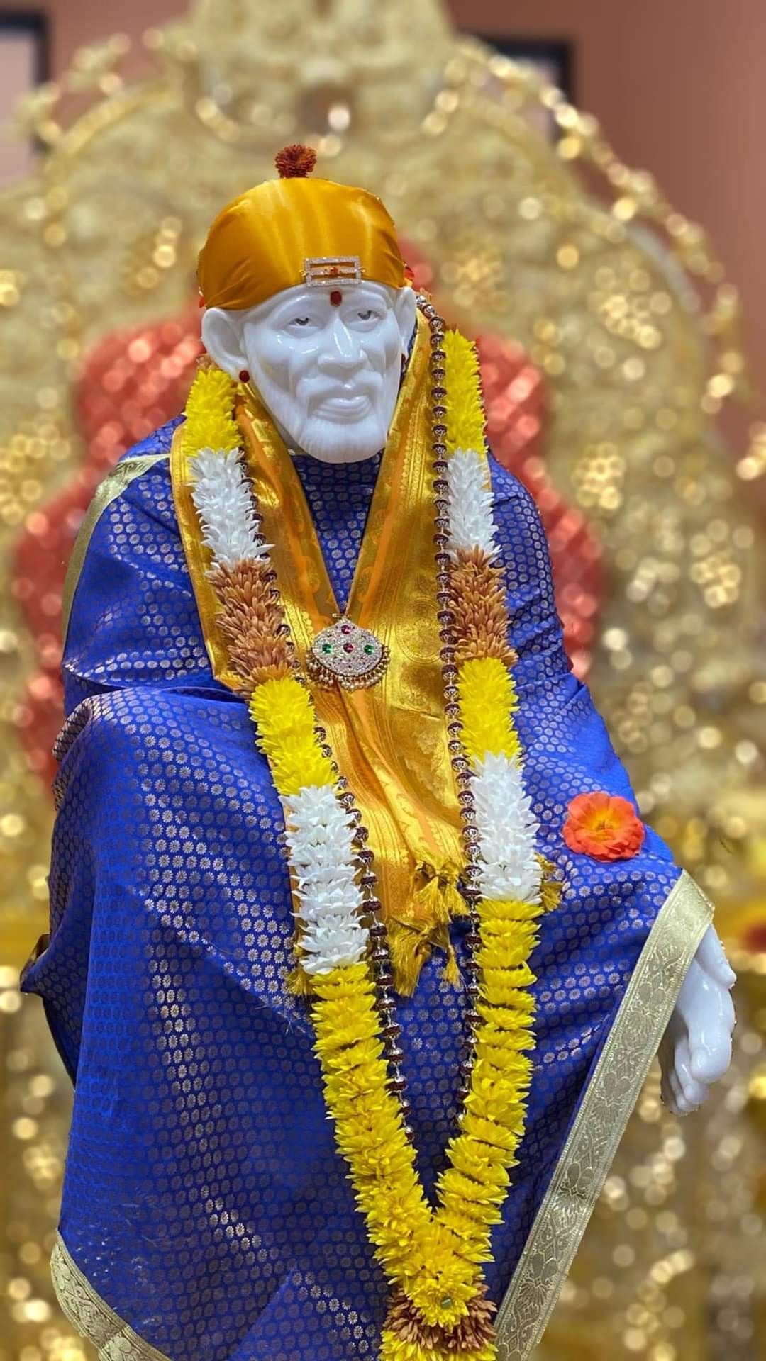 Sai Baba adorned with flowers