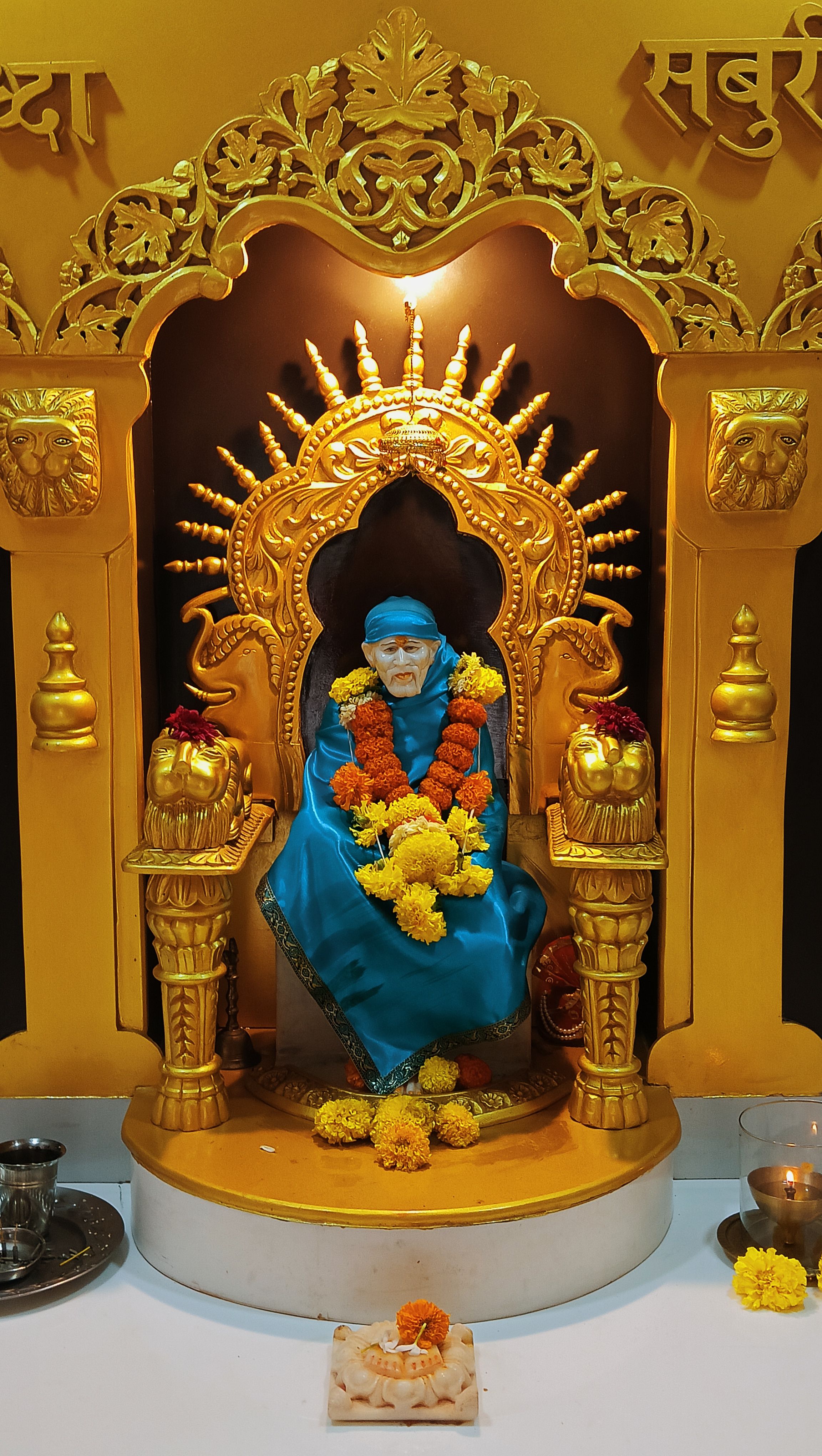 Sai Baba seated in golden temple