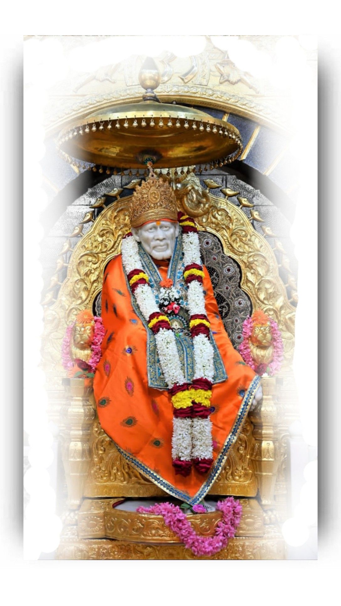 Sai Baba seated on a golden chair