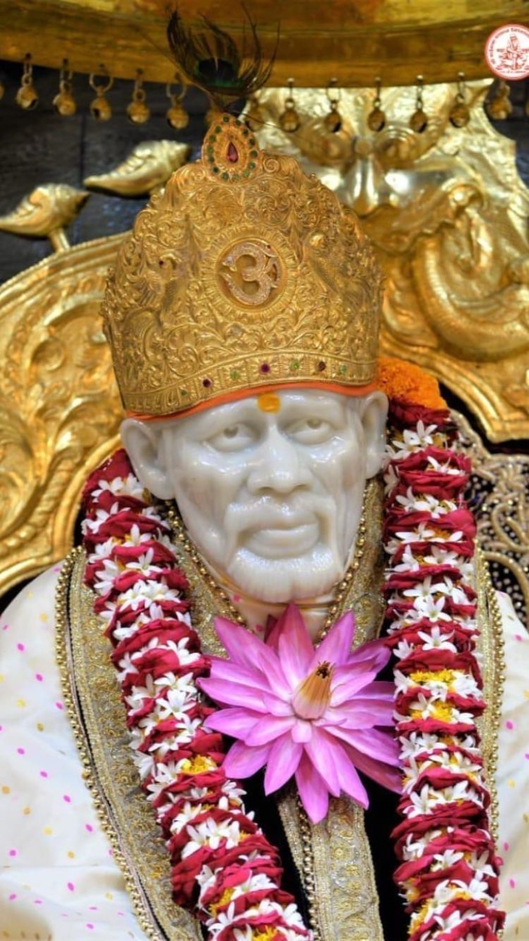 Sai Baba with floral adornments