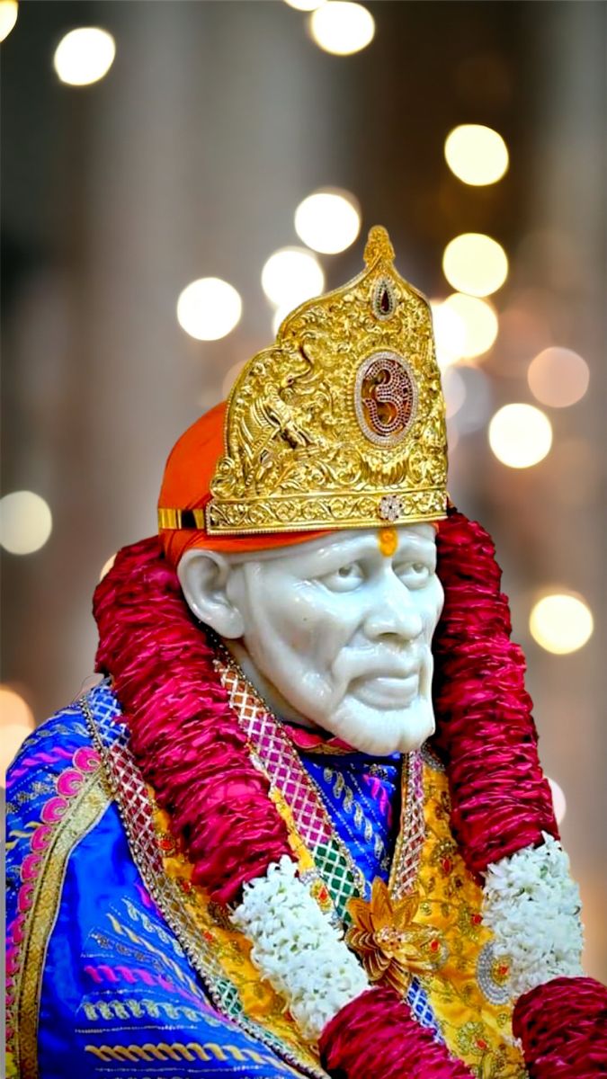Sai Baba in golden headgear portrait