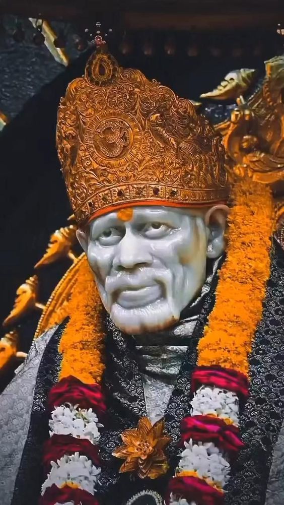 Close-up of Sai Baba with golden crown
