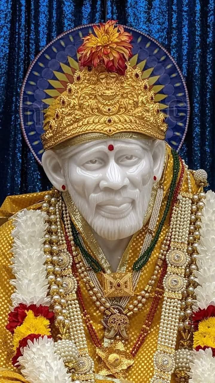 Sai Baba adorned with golden crown