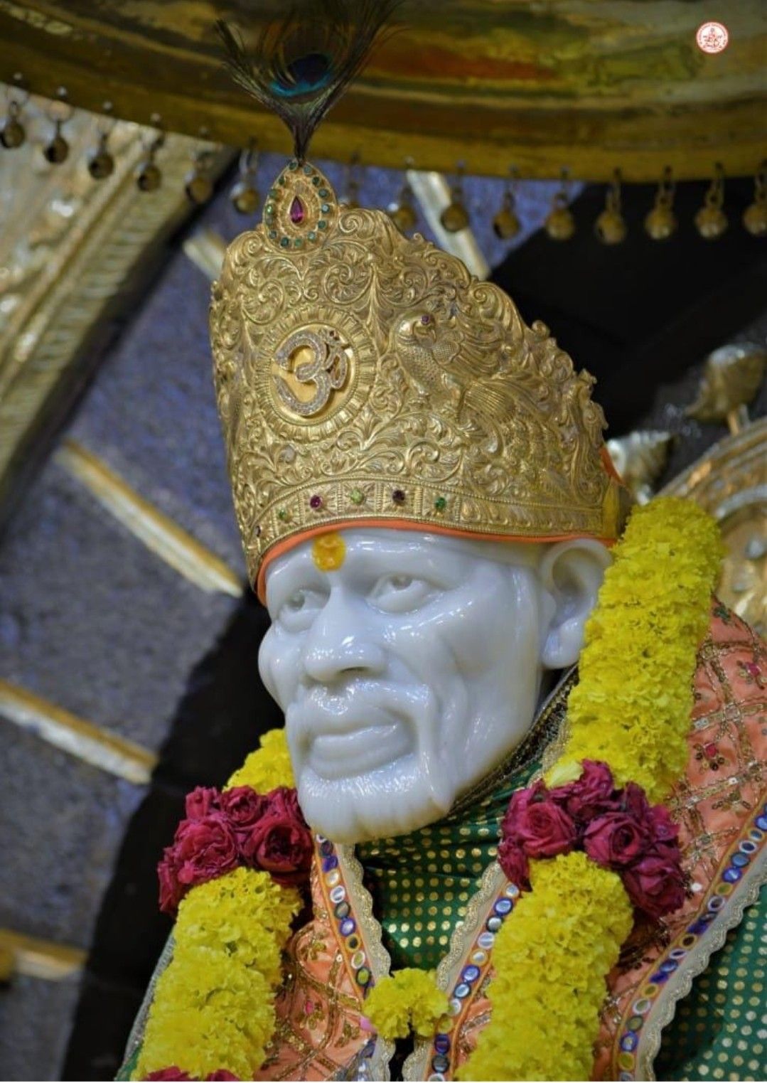 Sai Baba idol with golden crown.