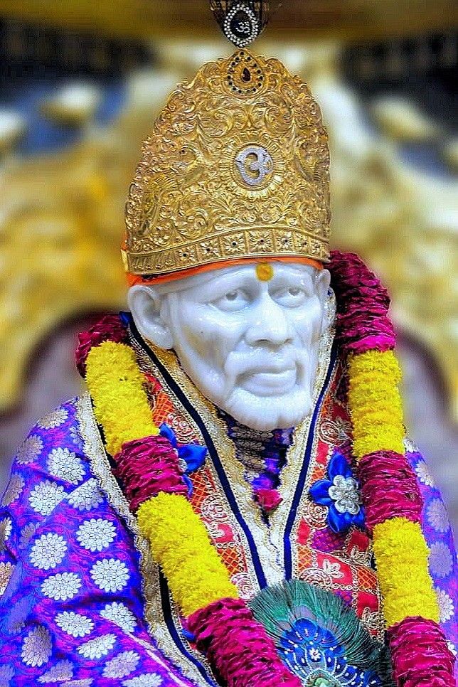 Sai Baba idol with golden crown