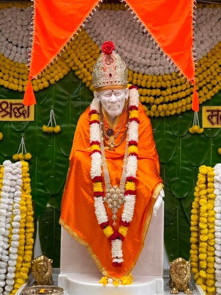 Sai Baba idol with floral garland