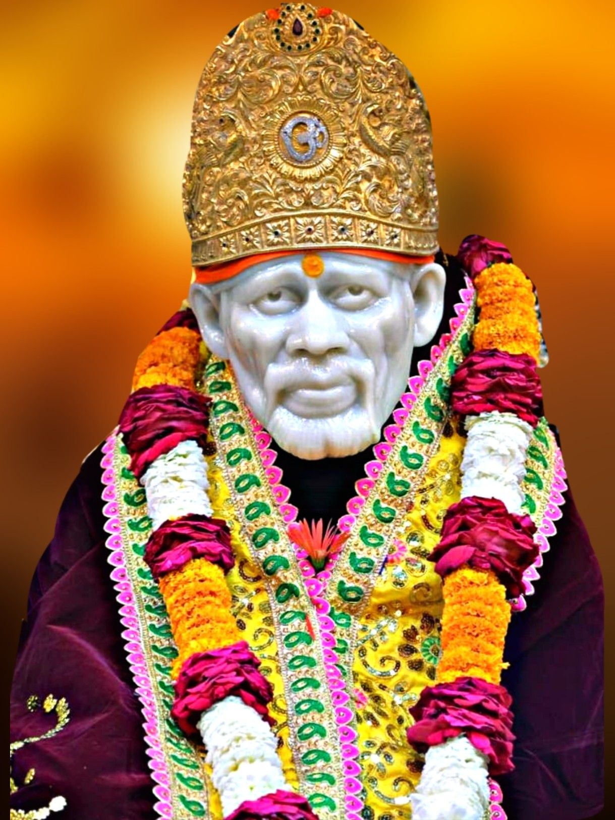 Sai Baba with floral garland and crown