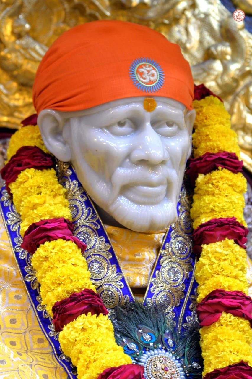 Sai Baba with floral garland portrait