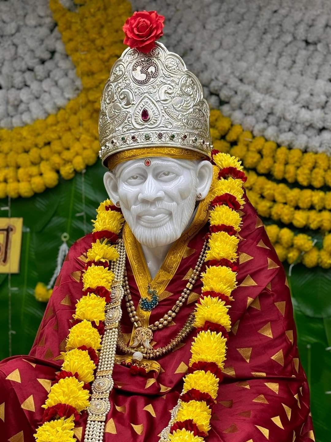 Sai Baba with floral garland portrait