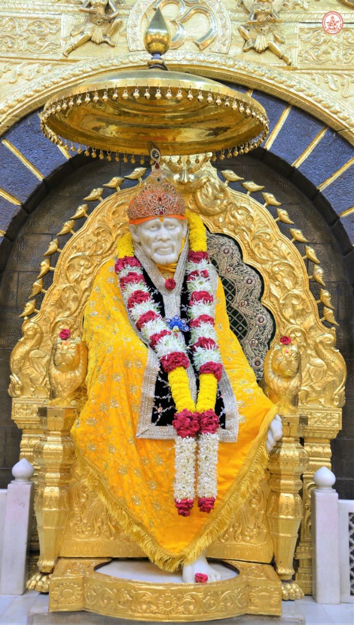 Sai Baba seated on golden throne