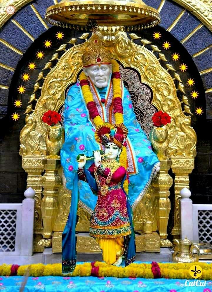 Sai Baba seated in golden frame
