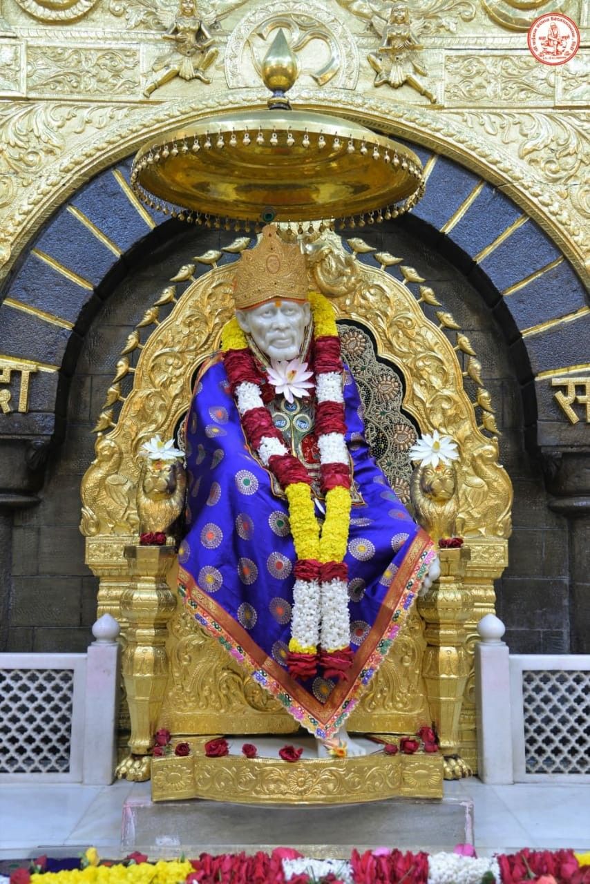 Sai Baba idol Shirdi temple flowers throne