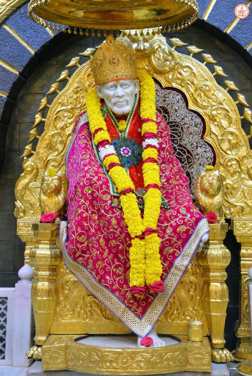 Sai Baba seated on golden throne