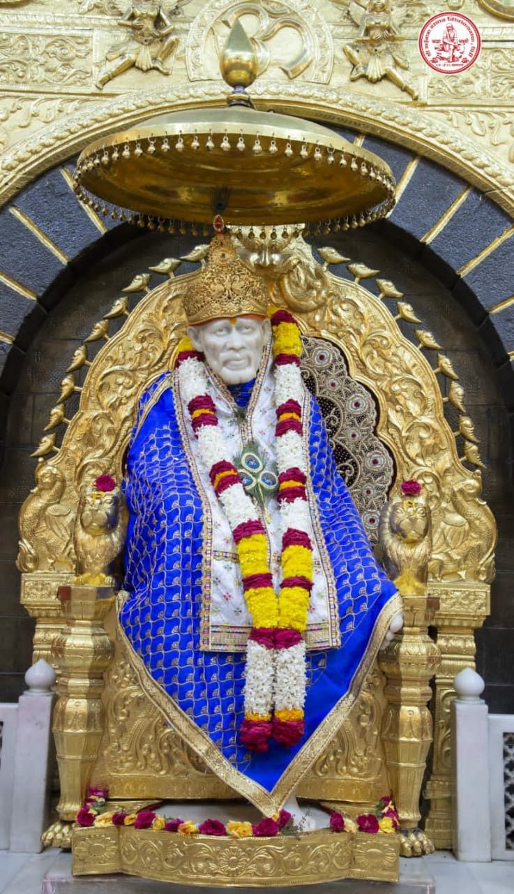 Sai Baba seated on golden throne
