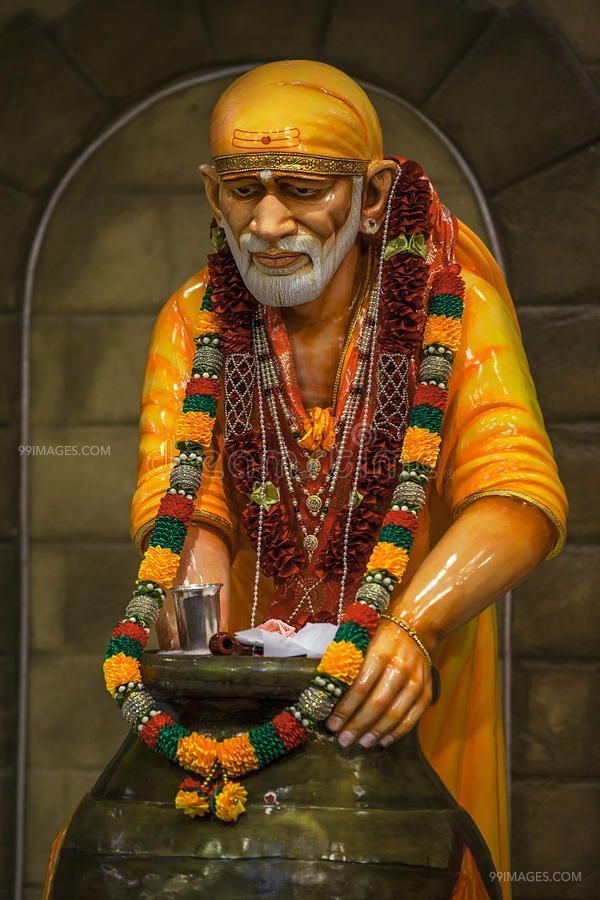 Sai Baba statue with flower garland