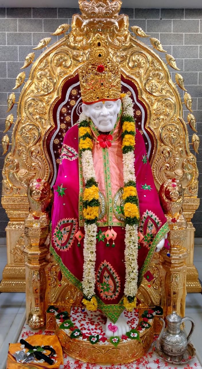 Sai Baba on golden throne image