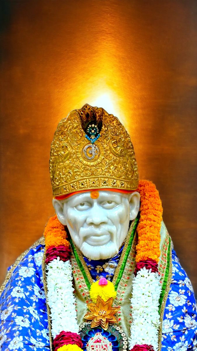 Sai Baba with floral garland and headgear