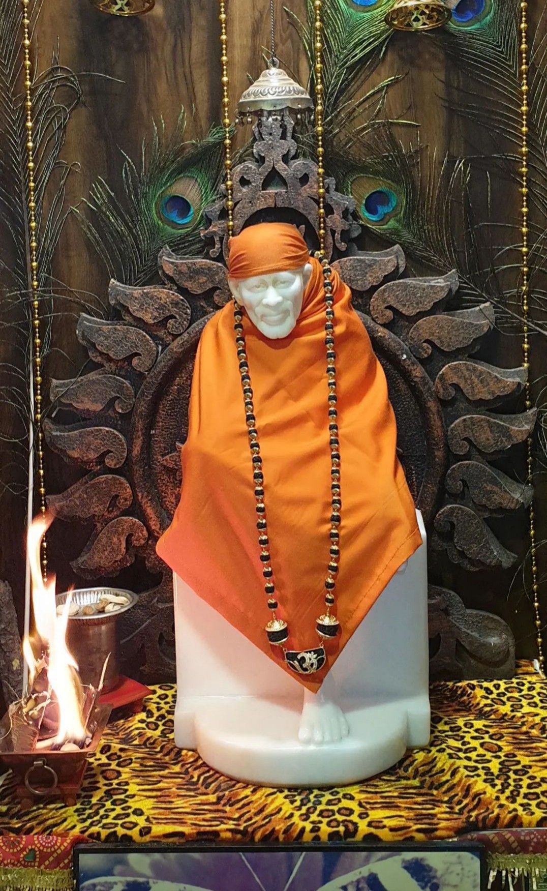Sai Baba statue in orange robes