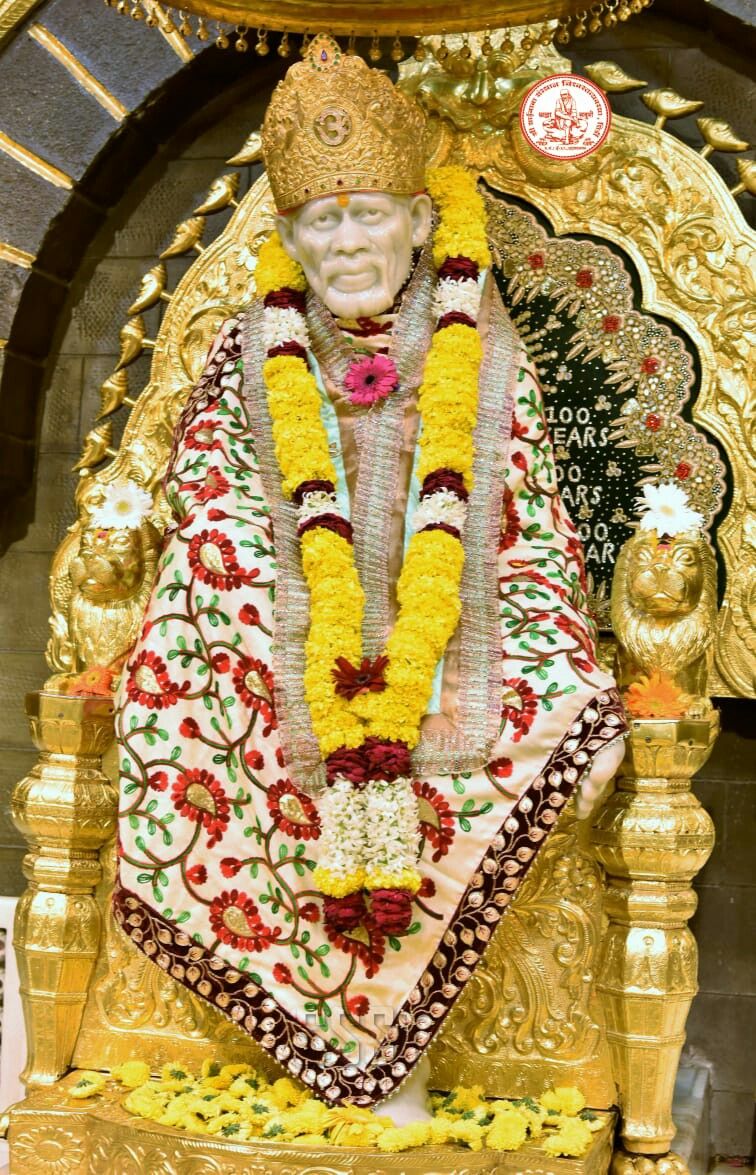 Sai Baba idol with floral garland